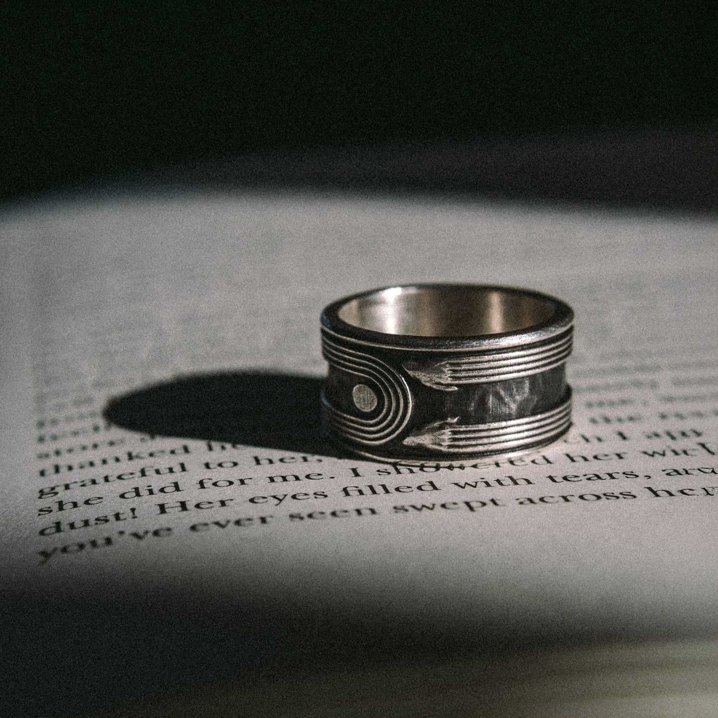 Solaque Crescent Hold handmade sterling silver ring jewellery on book