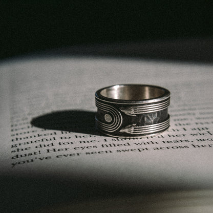 Solaque Crescent Hold handmade sterling silver ring jewellery on book