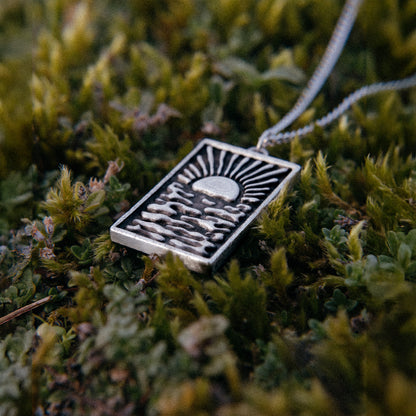 Solaque Echoes of Dusk handmade sterling silver pendant jewellery on grass