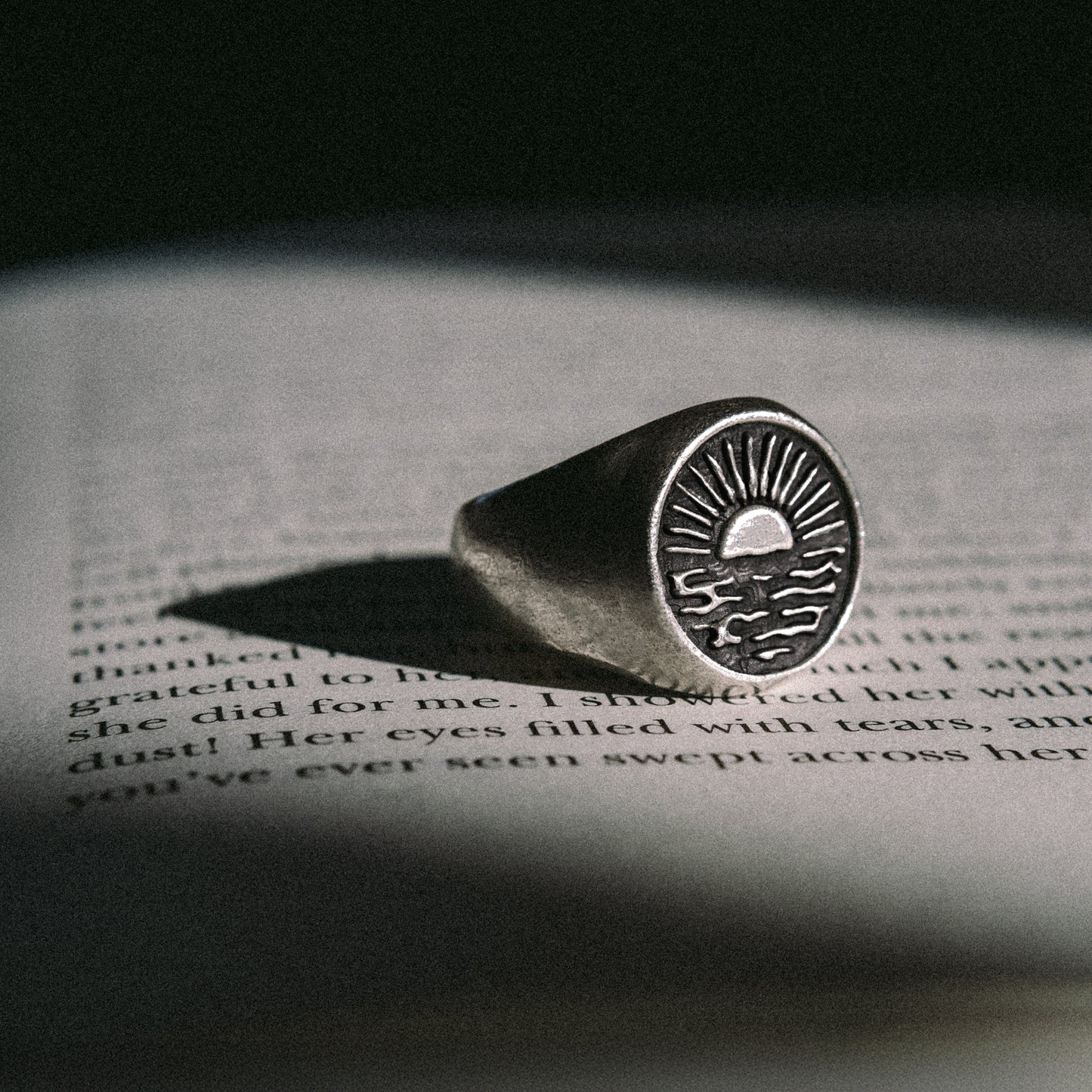 Solaque Echoes of Dusk handmade sterling silver ring jewellery on book