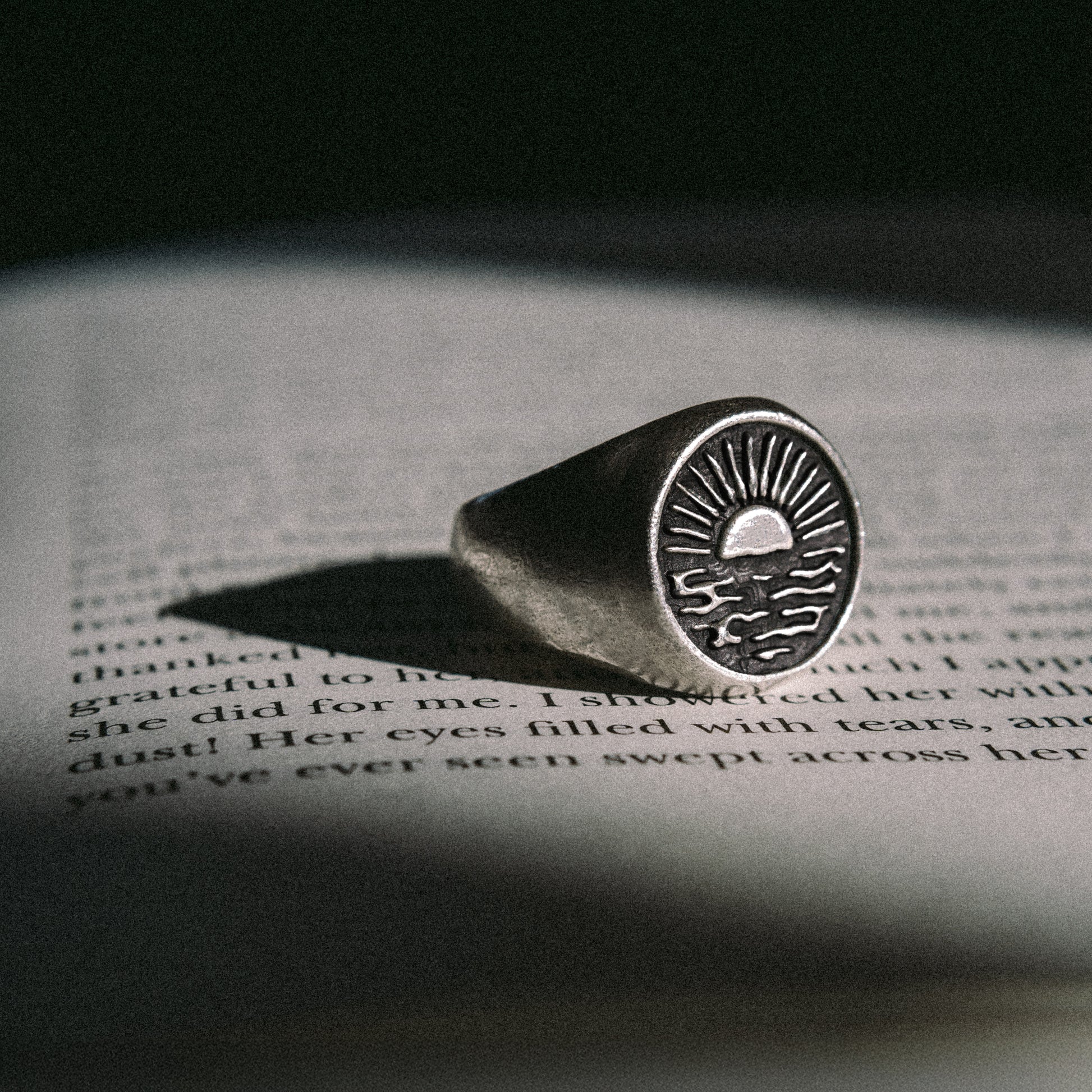 Solaque Echoes of Dusk handmade sterling silver ring jewellery on book