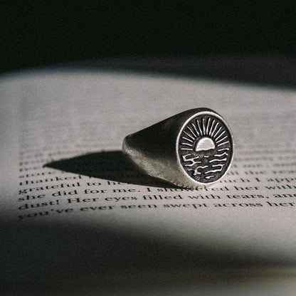 Solaque Echoes of Dusk handmade sterling silver ring jewellery on book
