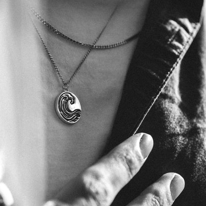 Solaque Ocean Drift handmade sterling silver wave design pendant jewellery worn by a person