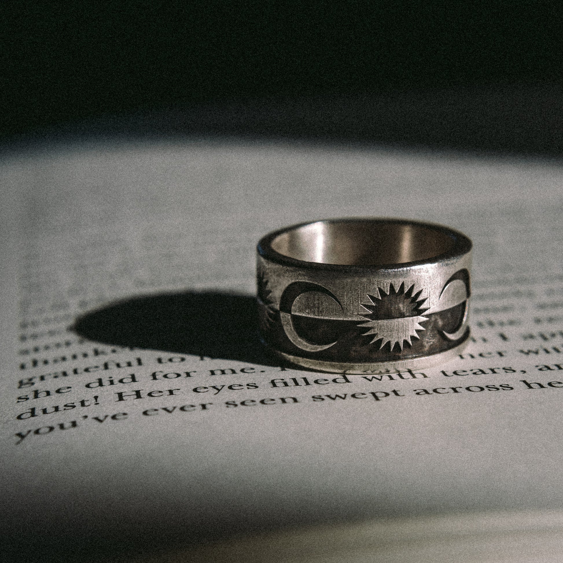 Solaque Solar Mirage handmade sterling silver ring jewellery on book