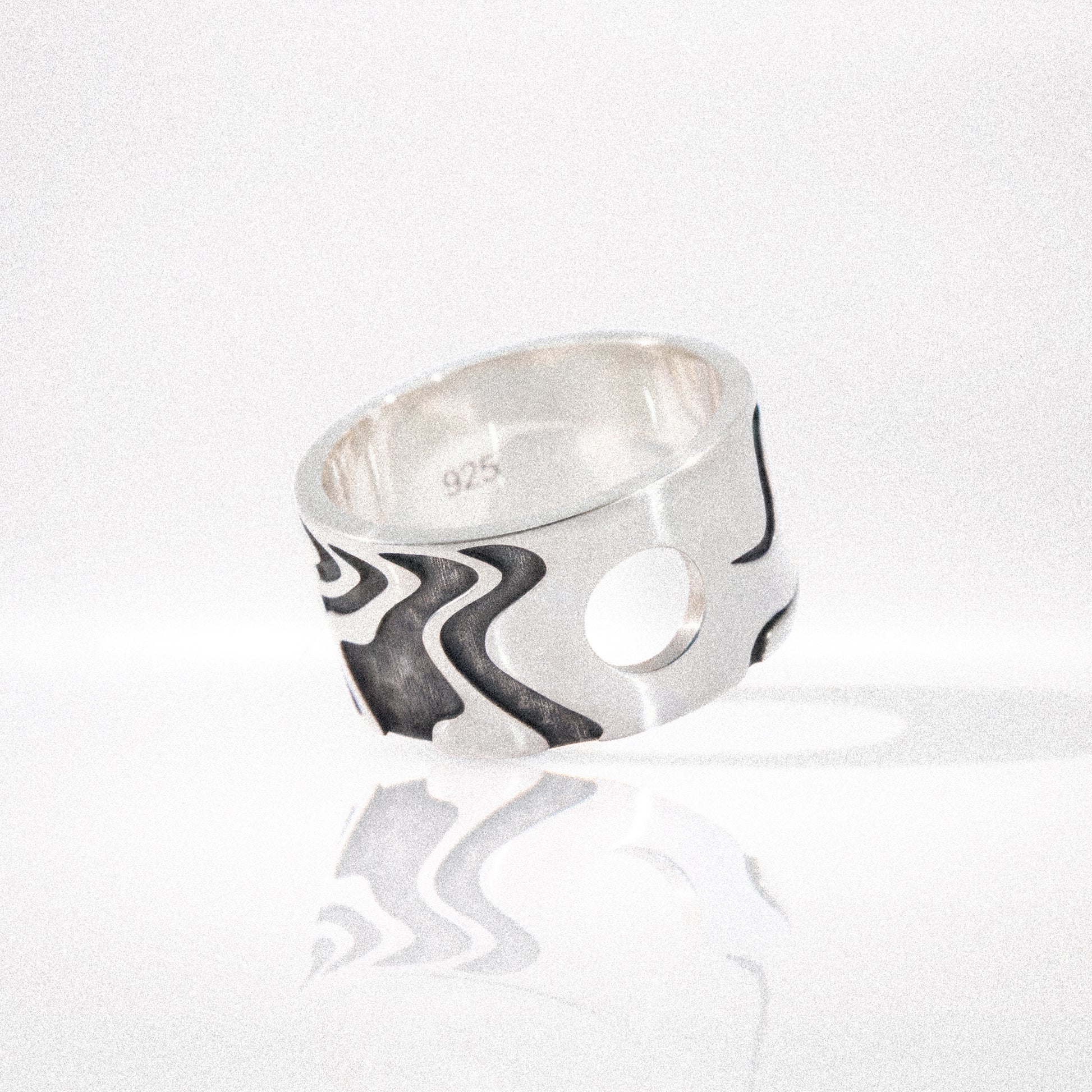 Solaque Tidal Motion handmade sterling silver ring jewellery on white background