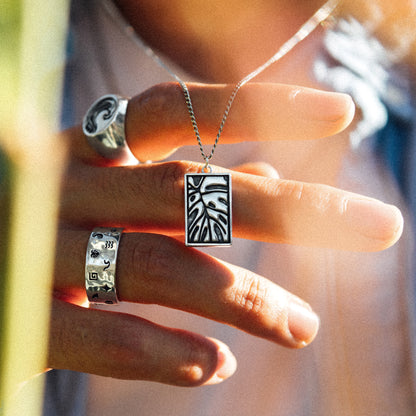 Solaque Veins of Monstera handmade sterling silver leaf design pendant jewellery held against fingers
