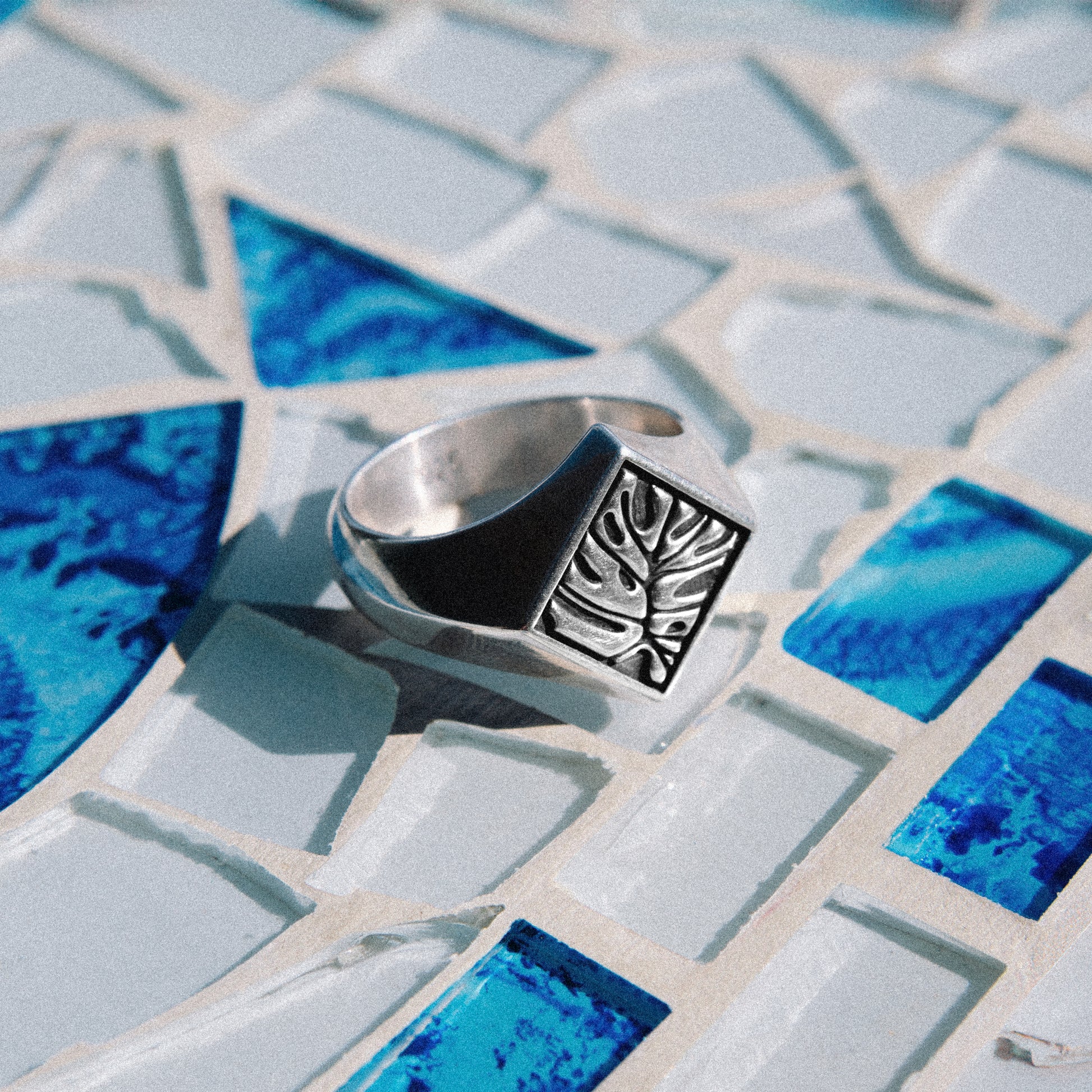 Solaque Veins of Monstera handmade sterling silver leaf design ring jewellery  on a mosaic tile surface